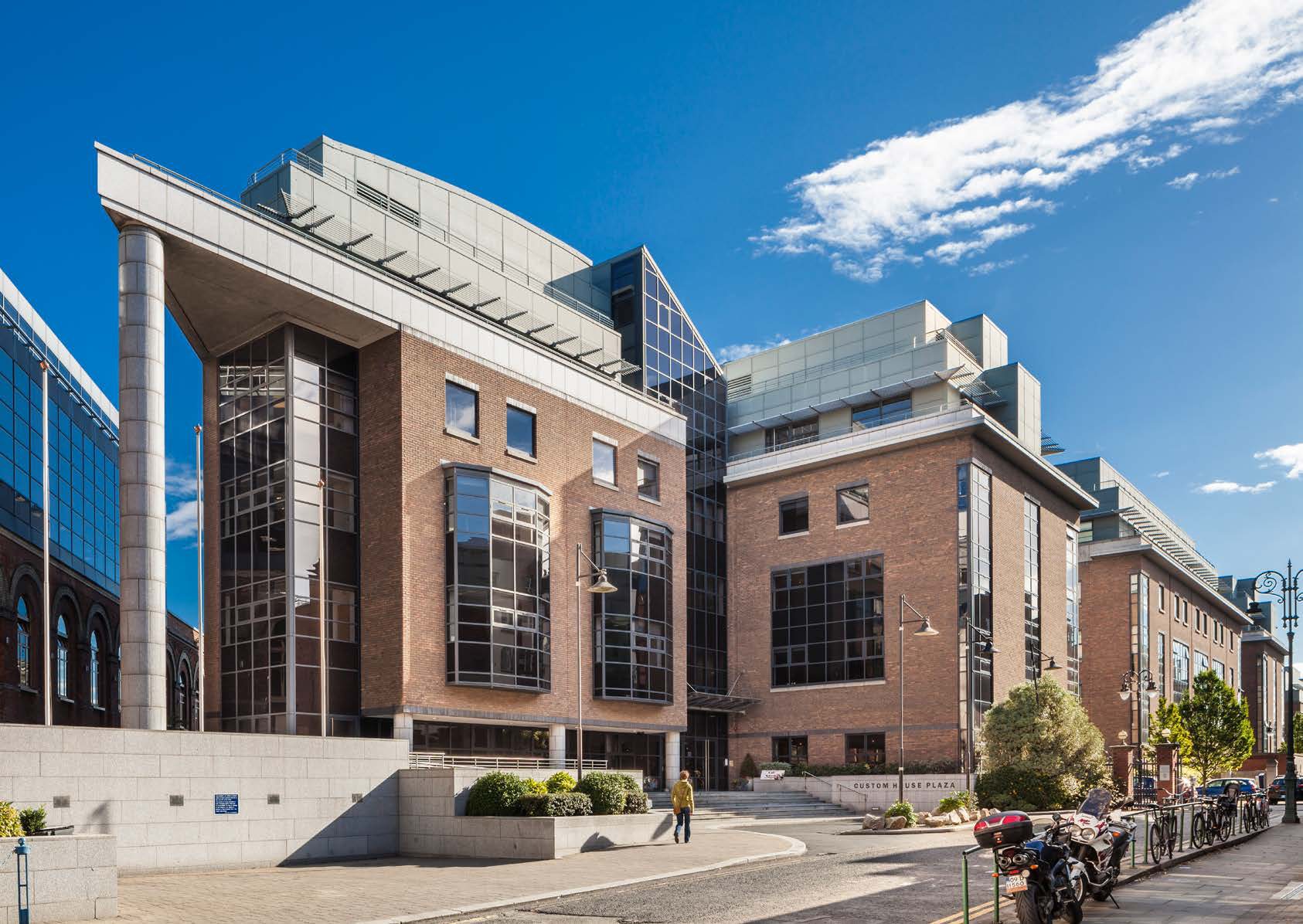 One Custom House Plaza, IFSC: the brick and glass elevation from the plaza