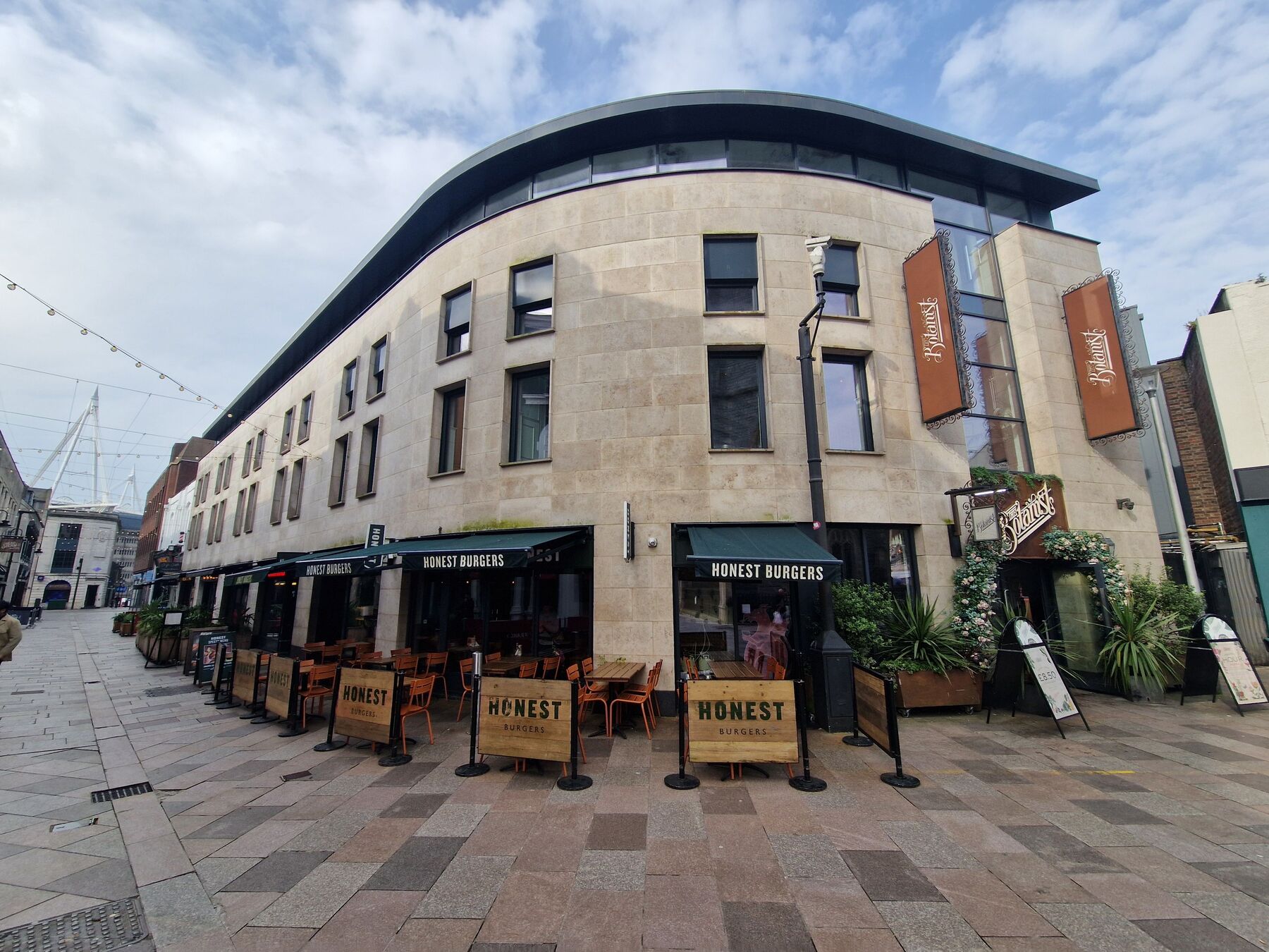 Church Street, Cardiff: the curved stone elevation with restaurants at street level